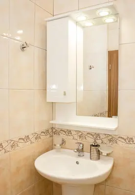 a bathroom with a white sink and a mirror at Bright Studio in Top Central Location in Varna by Flat Mаnager in Varna City