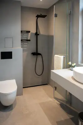 a bathroom with a shower and a toilet and a sink at Ваканционна Къща в Greenn Life Созопол in Sozopol
