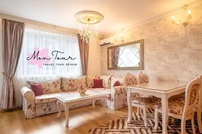 a living room with a couch and a table at Mon Tour apartments in Sunny Beach