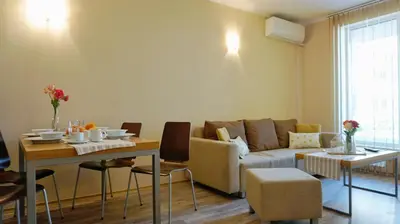 a living room with a couch and a table at Apartments Obzor Beach B - Апартаменти Обзор Бийч B in Obzor