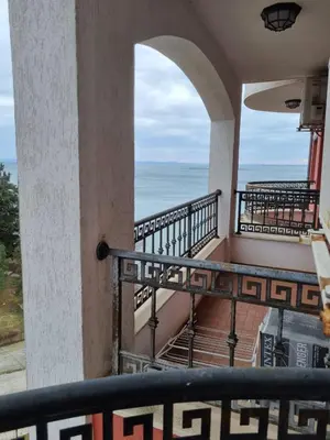 a balcony with a view of the ocean at Apartament BEACH VIBES Nessebar in Nesebar