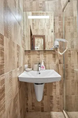 a bathroom with a sink and a shower at Studio in Sarafovo with Private Parking Spot by Flat Mаnаger in Burgas City