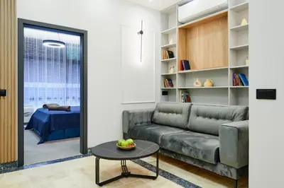 a living room with a couch and a table at Florance Rentals Luxury Apartments in Burgas in Burgas City