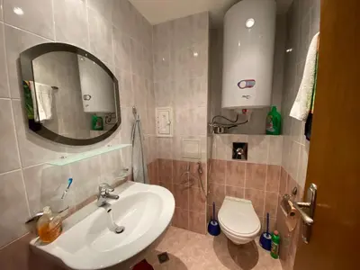 a bathroom with a sink and a toilet at YS Residence in Sunny Beach