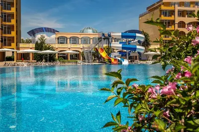 a large swimming pool with a water park at DL Apartments in Aheloy