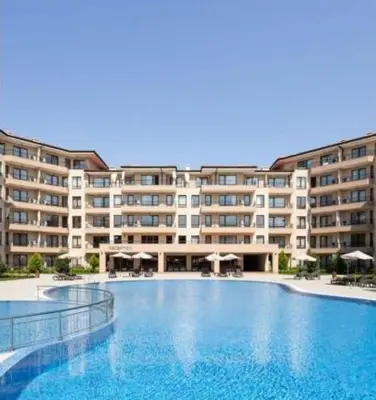 a large swimming pool in front of a large building at Sveti Vlas Sea Dreams apartament in Sveti Vlas