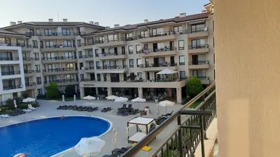a view from a balcony of a hotel with a swimming pool at Sveti Vlas Sea Dreams apartament in Sveti Vlas