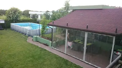 a house with a swimming pool and a yard at Aheloy Apartments in Aheloy