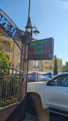 a truck parked next to a street light with a sign at Three-room apartment in Sveti Vlas