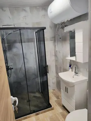 a bathroom with a shower and a sink at Apartment SUN RAYS Nesebar in Nesebar