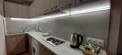 a small kitchen with a stove and a sink at Studio GALILEO in Burgas City