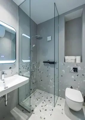 a bathroom with a shower and a toilet and a sink at Modern & Stylish Sea Apartment with Parking in Burgas City