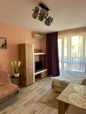 a bedroom with a bed and a table and a couch at Studio Sveti Vlas SEA BREEZE 3 in Sveti Vlas