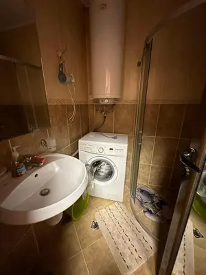 a bathroom with a washing machine and a sink at Studio Sveti Vlas SEA BREEZE 3 in Sveti Vlas