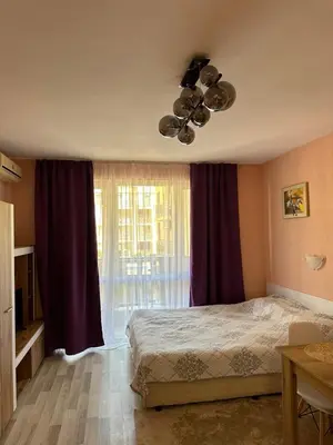 a bedroom with a bed and a large window at Studio Sveti Vlas SEA BREEZE 3 in Sveti Vlas