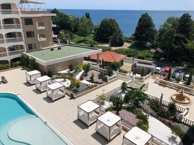 an aerial view of a resort with a pool and a tennis court at Valencia Gardens - Private apartment - BSR in Nesebar