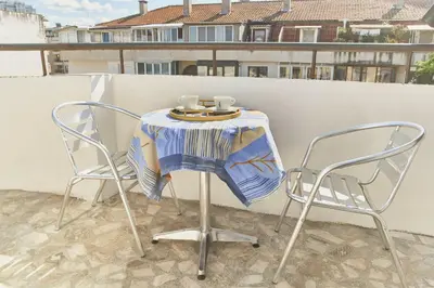 two chairs and a table with two cups on it at Batak Studio in Burgas City