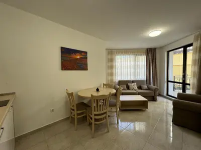 a living room with a table and a couch at HORIZON Apartment 8,1 'A' Sveti Vlas in Sveti Vlas