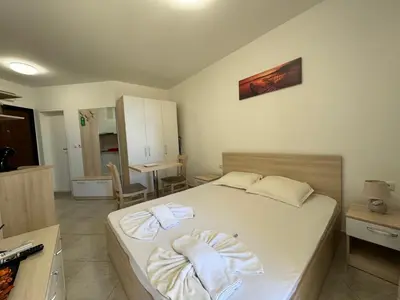 a bedroom with a bed with towels on it at HORIZON Apartment 8,1 'A' Sveti Vlas in Sveti Vlas