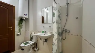 a bathroom with a toilet and a sink and a shower at KASANDRA 'Д' 5 Apartment Sunny Beach in Sunny Beach