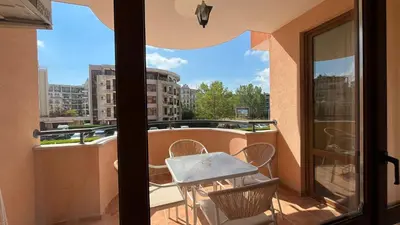 a balcony with a table and chairs and a window at KASANDRA 'Д' 5 Apartment Sunny Beach in Sunny Beach