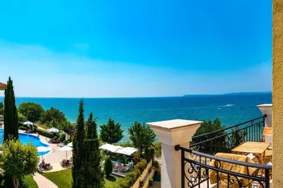 a view of the ocean from the balcony of a resort at HORIZON 12 'A' APARTMENT Sveti Vlas in Sveti Vlas