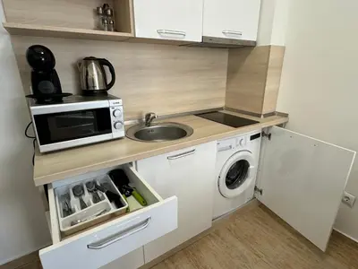 a small kitchen with a sink and a microwave at HORIZON 12 'A' APARTMENT Sveti Vlas in Sveti Vlas
