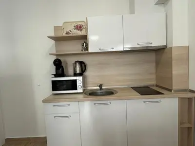 a small kitchen with a sink and a microwave at HORIZON 12 'A' APARTMENT Sveti Vlas in Sveti Vlas