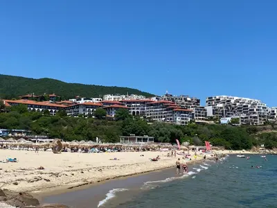 a group of people on a beach with buildings at HORIZON 19 'A' APARTMENT Sveti Vlas in Sveti Vlas