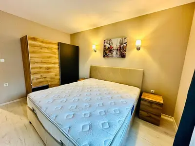 a bedroom with a bed in a room at Blue Marine - Daneli Apartment in Sunny Beach