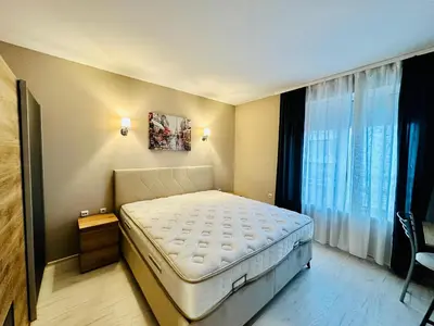 a bedroom with a bed and a large window at Blue Marine - Daneli Apartment in Sunny Beach
