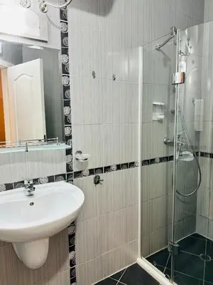a bathroom with a sink and a glass shower at Blue Marine - Daneli Apartment in Sunny Beach