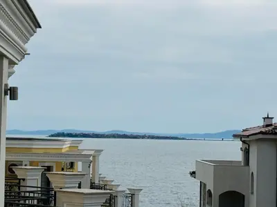 a view of a large body of water between buildings at HORIZON 38 'Б' Studio Sveti Vlas in Sveti Vlas