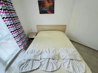 a bed in a room with two pillows at HORIZON 31 'Б' Apartment Sveti Vlas in Sveti Vlas