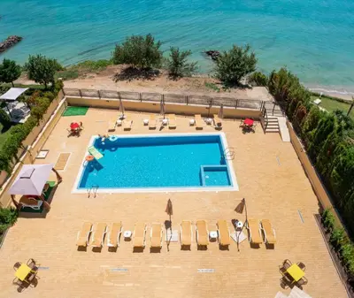 an overhead view of a swimming pool with chairs and the ocean at HORIZON 26 'Б' Apartment Sveti Vlas in Sveti Vlas