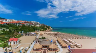 an aerial view of a beach with umbrellas and the ocean at HORIZON 25 'Б' Apartment Sveti Vlas in Sveti Vlas