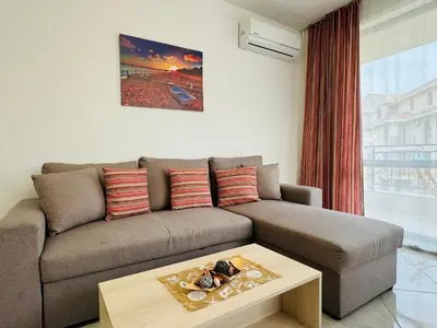 a living room with a couch and a coffee table at HORIZON 20 'Б' Apartment Sveti Vlas in Sveti Vlas
