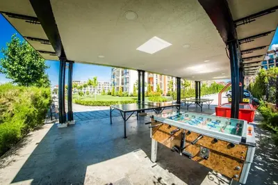 a room with two tables and a pool table at Seaside Serenity Studio - Premier Fort Beach in Sveti Vlas