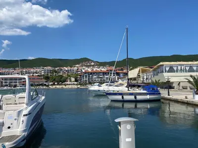 two boats docked in a marina with a city at HORIZON 19 'Б' Studio Sveti Vlas in Sveti Vlas
