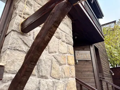 a large wooden sign on the side of a building at Arthotel Oscar II Sozopol in Sozopol