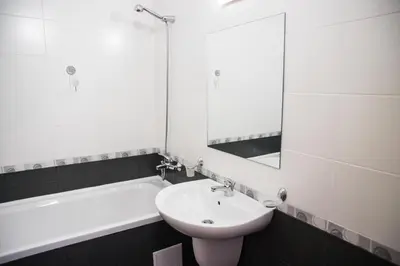 a bathroom with a sink and a mirror and a tub at Studio in Garden of Eden D402 - Sveti Vlas, Bułgaria in Sveti Vlas