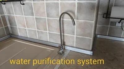 a kitchen sink with a water purification system at Luxury Sea Sunset Deluxe Apartment in Burgas City