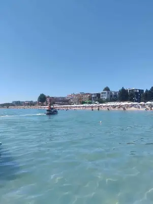 a view of a beach with a boat in the water at Oasis2 in Nesebar