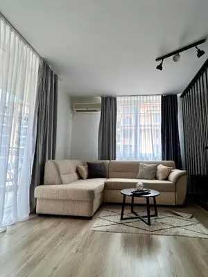 a living room with a couch and a table at Karolina Apartment 65 in Sunny Beach