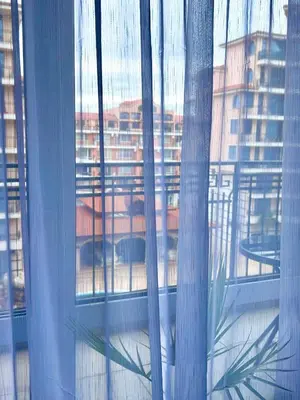 a window with a view of a city at Karolina Apartment 65 in Sunny Beach