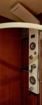 a stove top oven in a kitchen with red tiles at Апартамент ЛазуР in Burgas City
