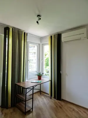 a room with a table and a window at Дом Крумови in Burgas City