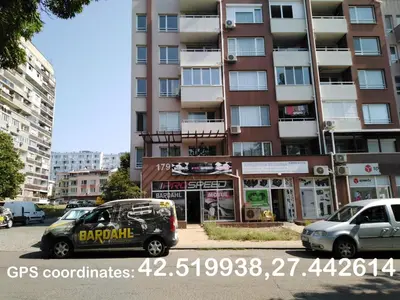 two cars parked in front of a building at Дом Крумови in Burgas City