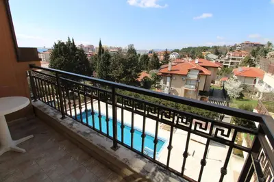 a balcony with a view of a swimming pool at Horizont - Menada Apartments in Sunny Beach