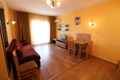 a living room with a couch and a table at Horizont - Menada Apartments in Sunny Beach